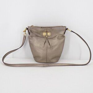 B. Makowsky Gold Metallic Trun-Lock Bucket Crossbody Bag